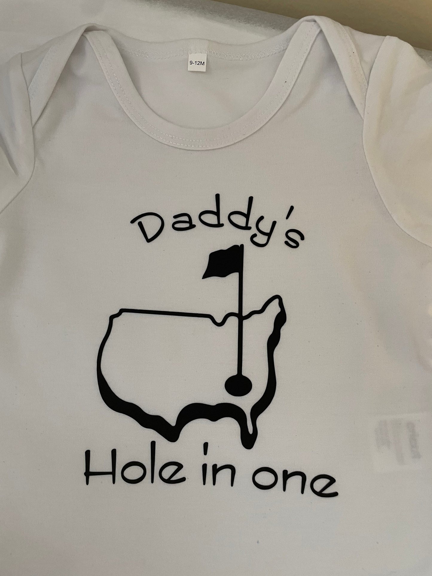 Daddy’s hole in one!